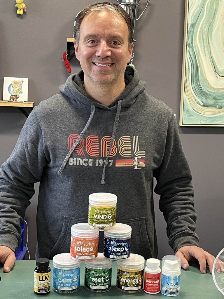 Chris Denicola of Wolf Sciences poses with his line of gummies that blend cannabinoids and functional mushrooms.