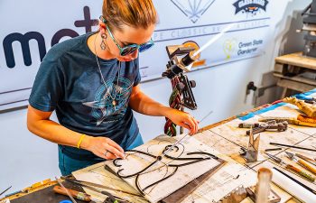 Shayla Windstar's journey in glass art entrepreneurship illuminates the path from a Pueblo head shop to national acclaim. Her story weaves through personal growth and the mastery of an ancient craft, inspiring a new era of artists.